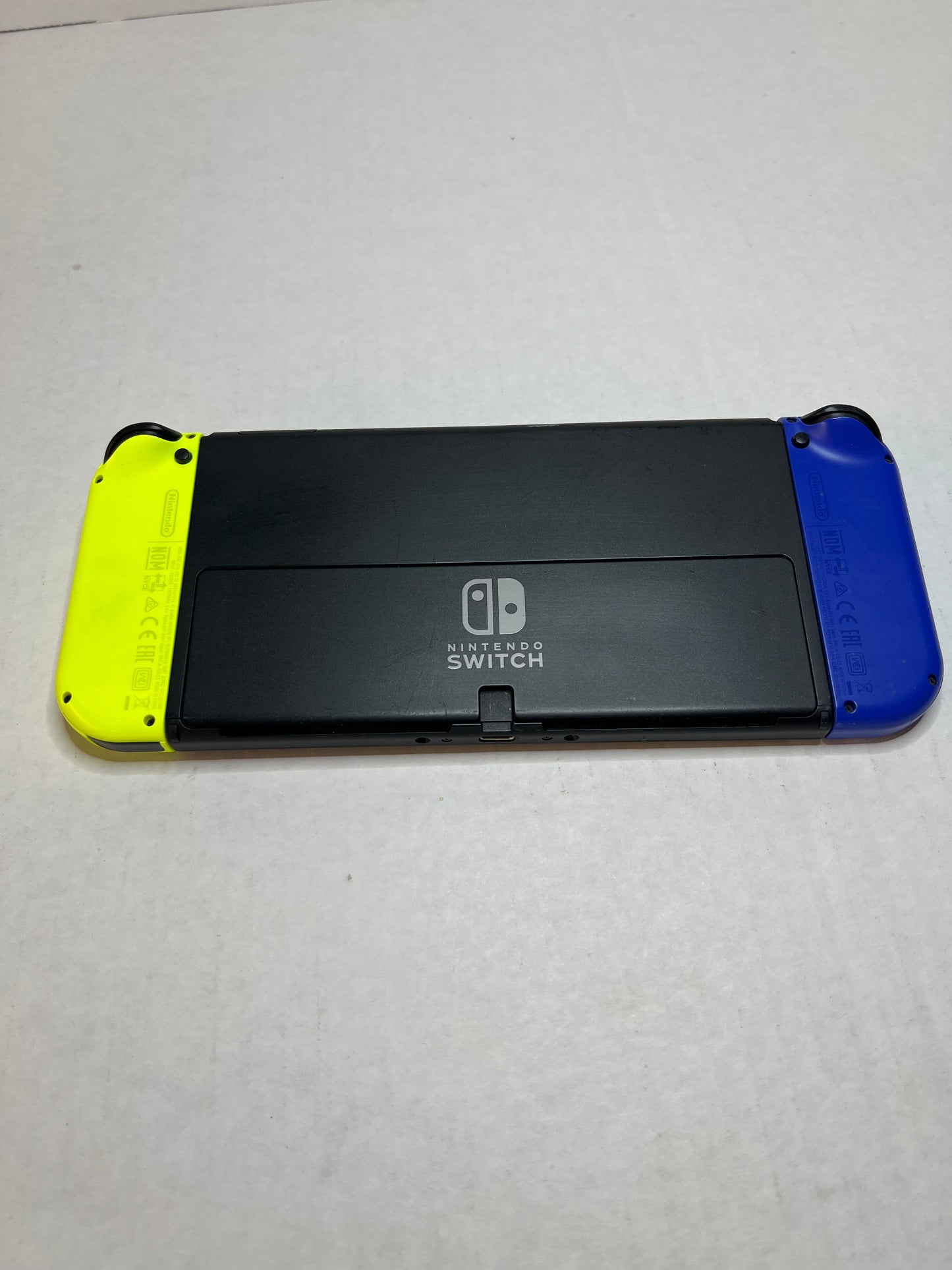 OLED Switch (Blue & Yellow joycons)(missing back panel on dock)