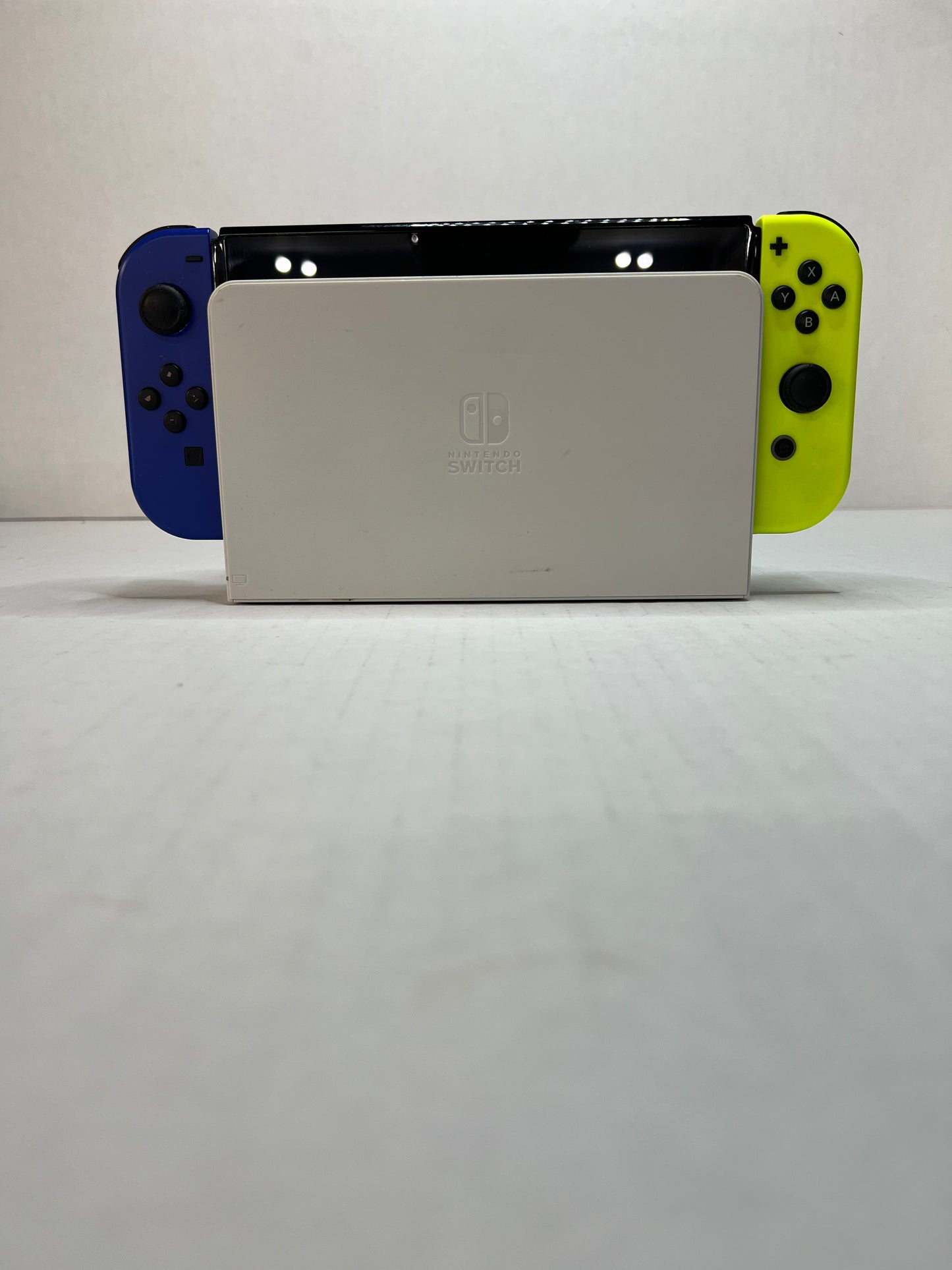 OLED Switch (Blue & Yellow joycons)(missing back panel on dock)