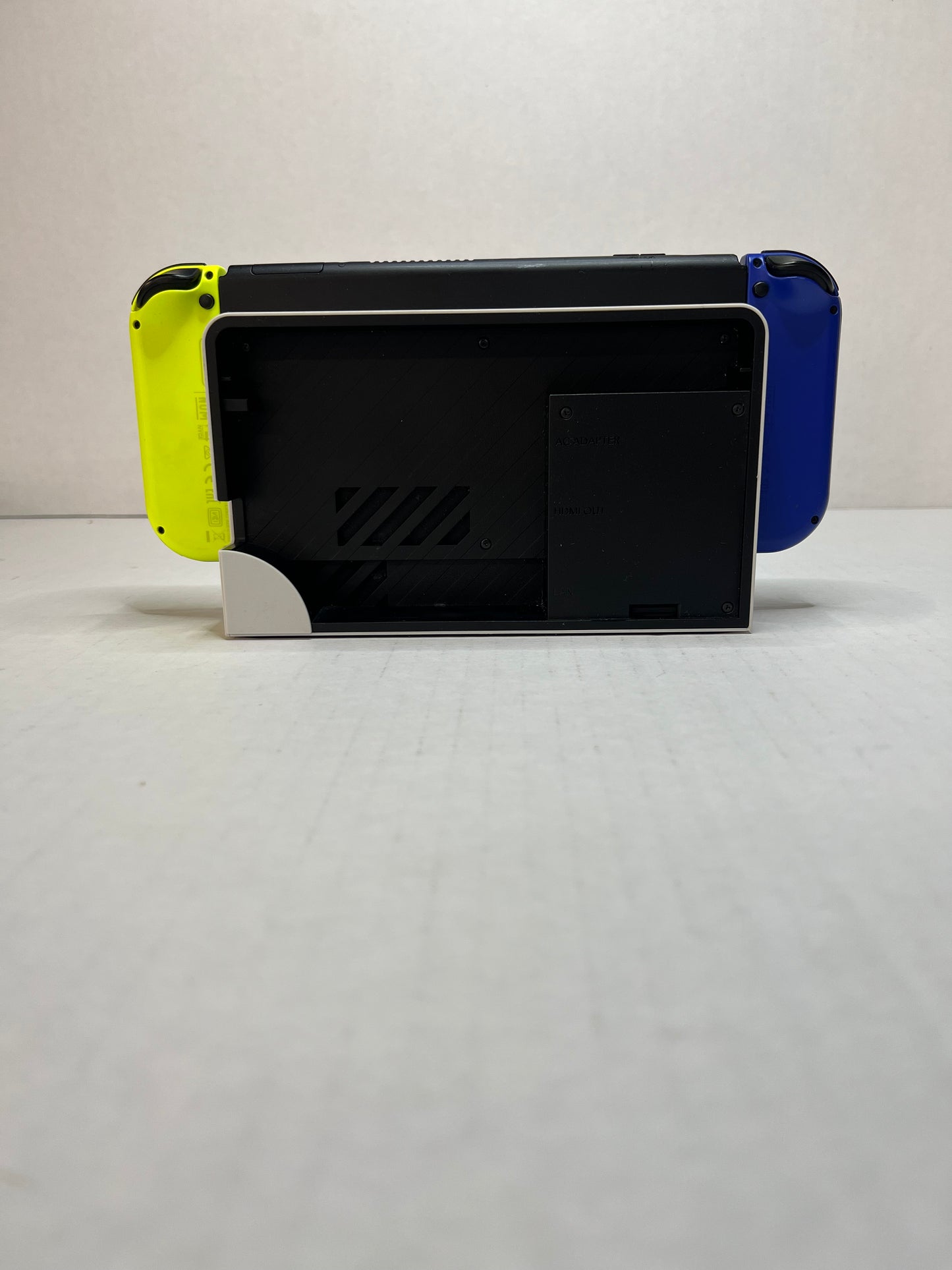 OLED Switch (Blue & Yellow joycons)(missing back panel on dock)