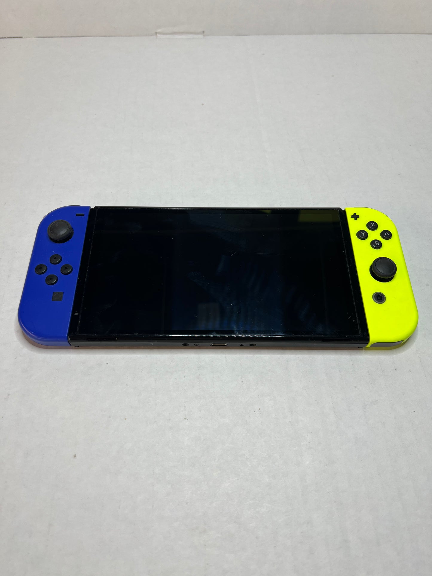 OLED Switch (Blue & Yellow joycons)(missing back panel on dock)
